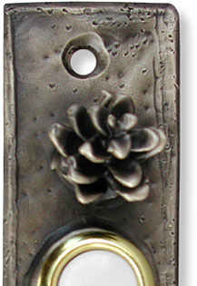 Narrow open cone doorbell button closeup