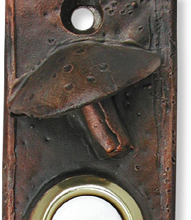 Toadstool doorbell button closeup
